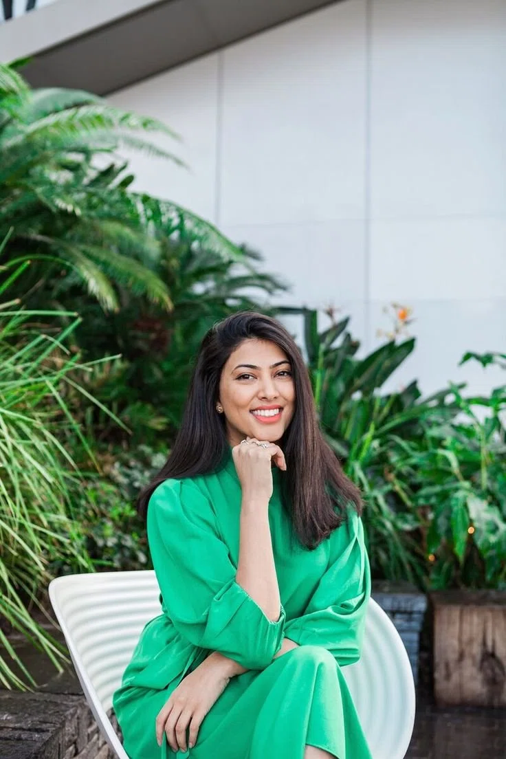 Best Performance Marketer in ErnakulamWoman in green outfit sitting outdoors with plants